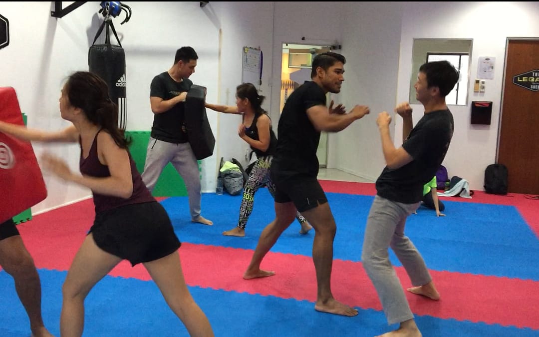 Where can you attend self-defense classes in Singapore?